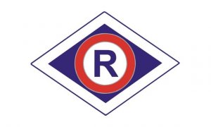 R w trójkącie symbol ruchu drogowego